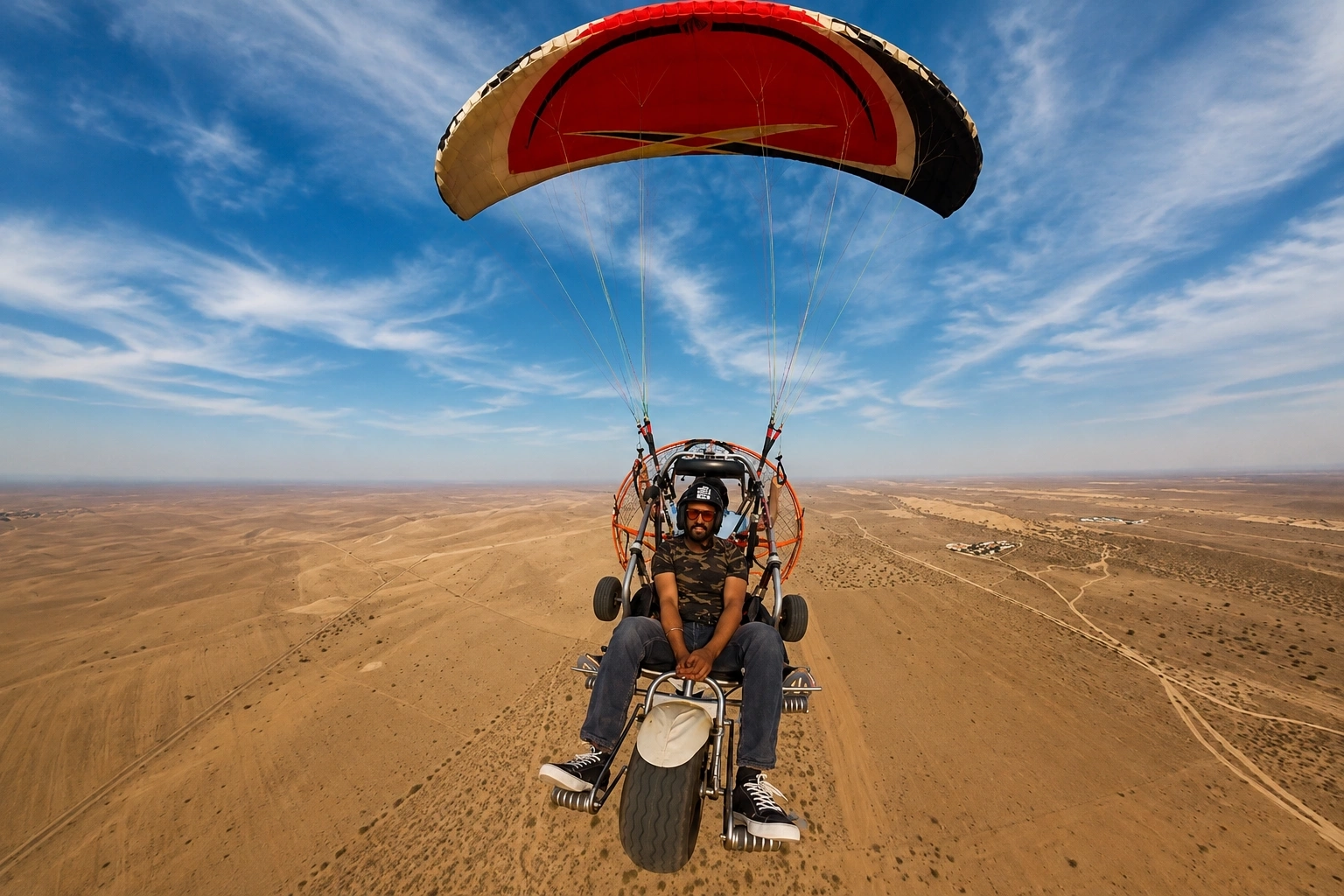 Paramotor flying high above the Jaisalmer desert